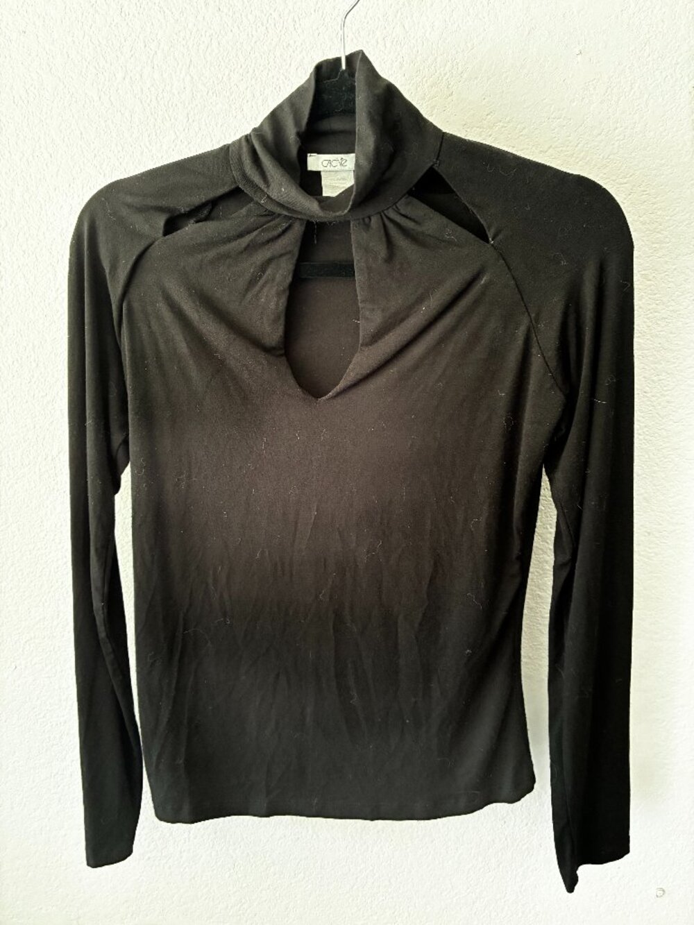 Cache black top with cut outs.
